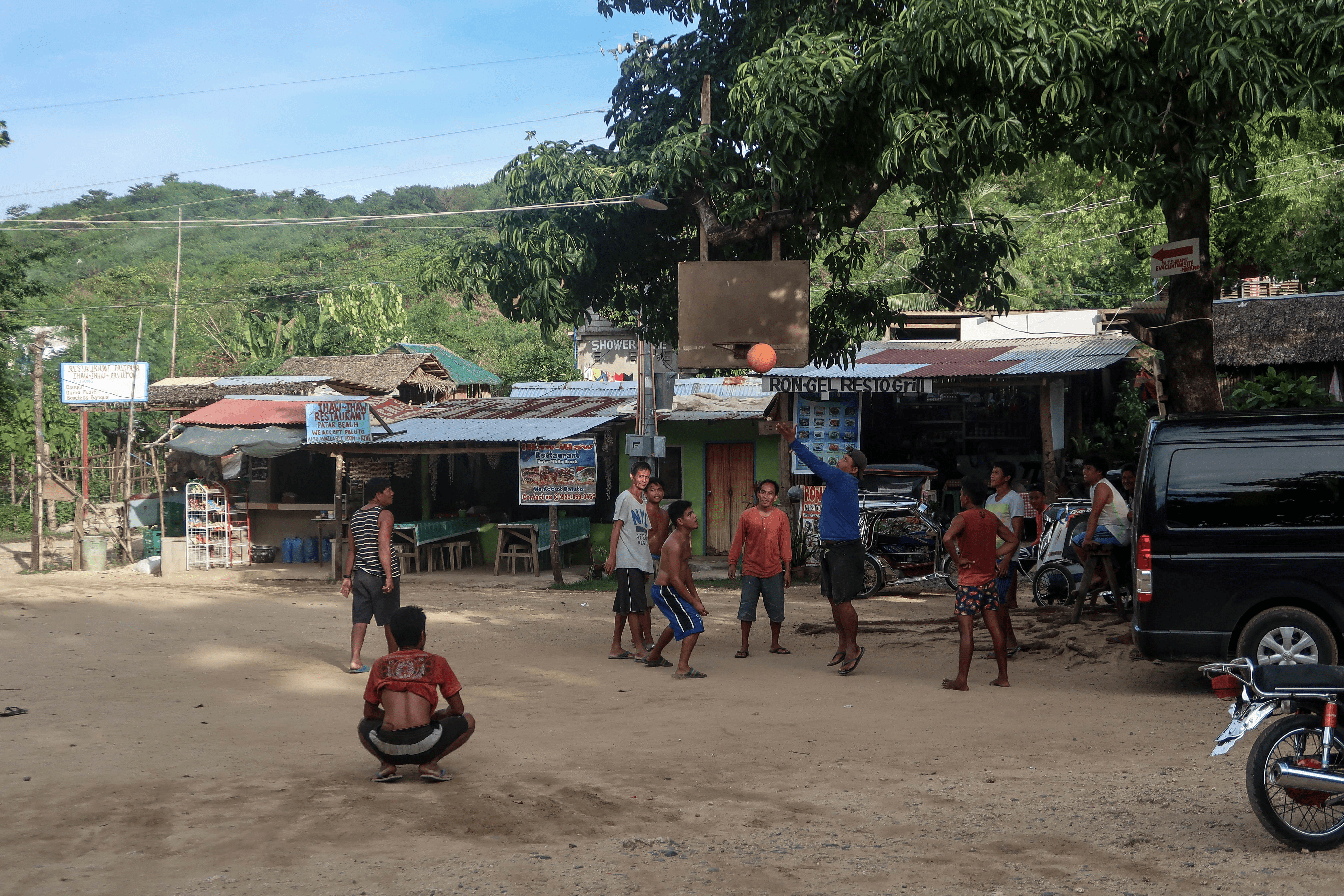 basketball playing filipino youth in barangay at patar beach area in bolinao pangasinan province philippines